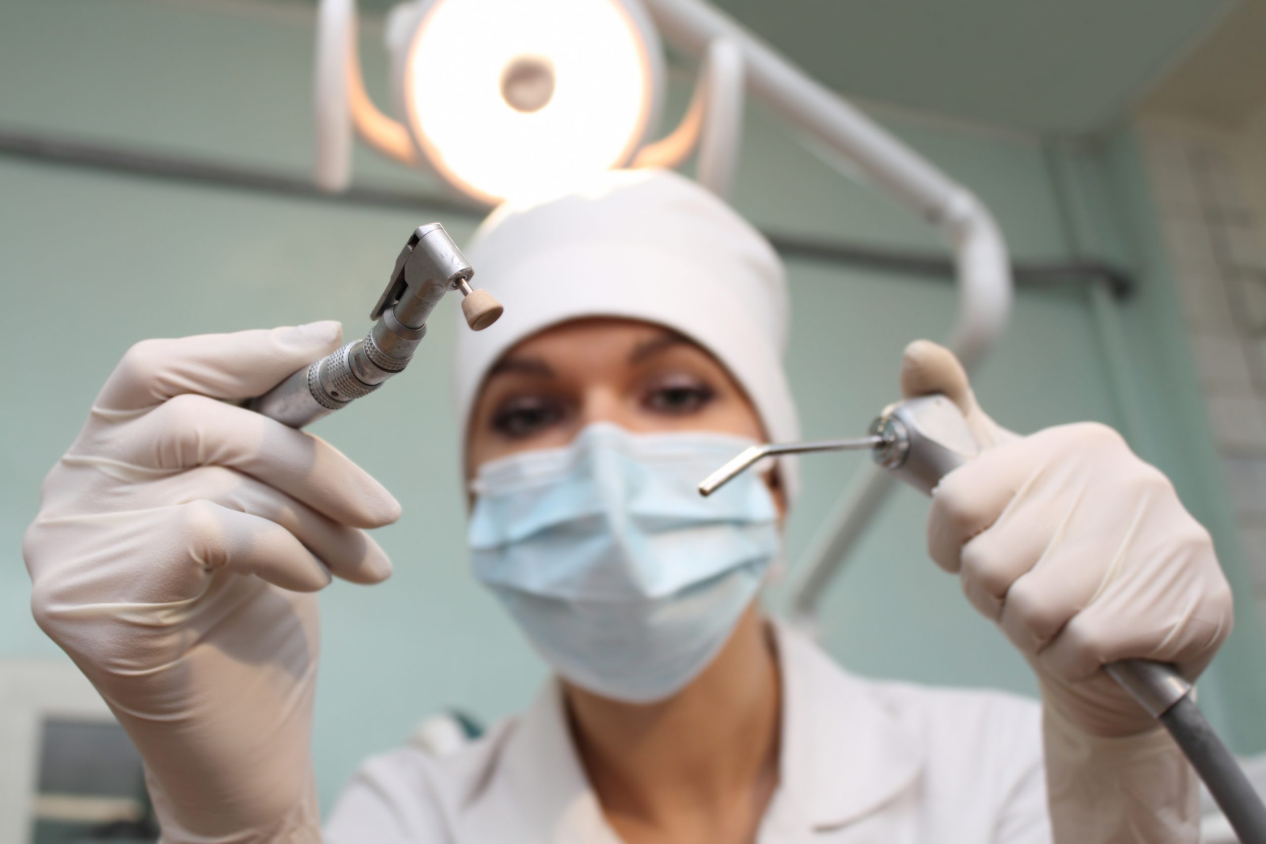 Dentist with instrument